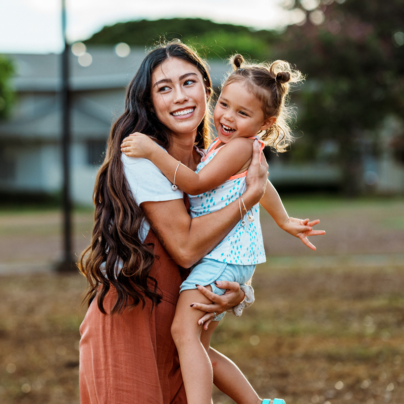 lady and kid smiling and hugging